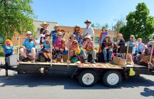The Blue Skies Community Fiddle Orchestra performed at the Perth Pride Parade on June 3